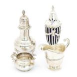 A collection of silver to include: an Elizabeth II silver caster, baluster shaped on three shell and