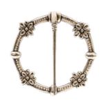 Alexander Ritchie- A Scottish silver kilt/plaid brooches, circular form with daisy decoration,