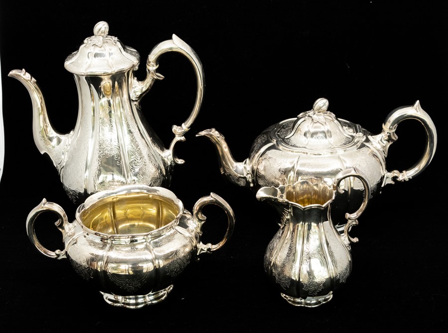 A Victorian silver four piece tea service including teapot, hot water/coffee pot, sugar bowl and