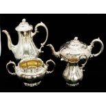 A Victorian silver four piece tea service including teapot, hot water/coffee pot, sugar bowl and