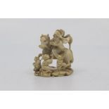 A Japanese carved ivory okimono signed Tamayama, Meiji period, modelled as a sage carrying a