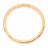 A 9ct rose gold slave bangle, hollow form with chamfered edges, width approx 8mm, depth approx