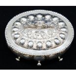 A late Victorian Renaissance Revival silver box and cover, with lobed body on four scroll feet,