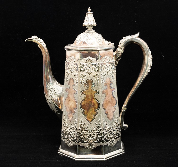 A Victorian silver tapering cylindrical coffee pot, Chinoserie style profusely chased with panels of