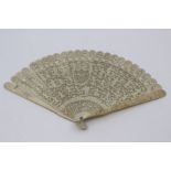 A Chinese Canton ivory brise type fan, early 19th Century, the guards carved with dense flowers