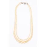 An Art Deco three row pearl and diamond necklace, comprising three graduated rows of pearls the