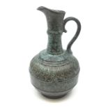 A Chinese Burnished bronze effect Porcelain Ewer bearing inscissed Qianlong mark with molded