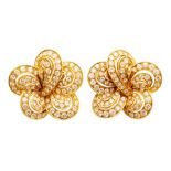 A pair of diamond and 18ct gold earrings, flower form with each petal grain set with round brilliant