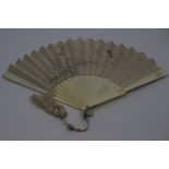 Two Chinese fans, 19th Century, the first ivory and painted silk, the guards carved with oval