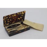 An early 20th Century tortoiseshell cased ladies manicure box, of rectangular outline, comprising