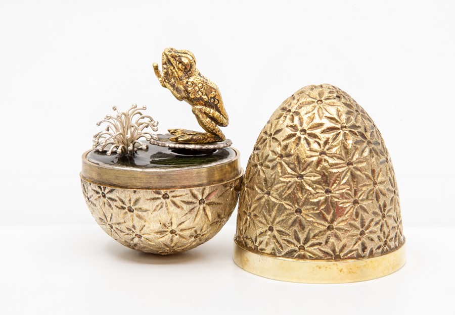 Stuart Devlin silver gilt surprise 'frog in the pond' egg, decorative flower textured form,