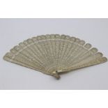 A Chinese Canton ivory brise fan, first half 19th Century, the guards carved with pagodas amid