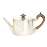 A Victorian silver oval teapot, straight spout with fruitwood C-scroll handle and pagoda  shaped