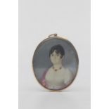 English school, early 19th Century A portrait miniature on ivory depicting a young lady wearing a