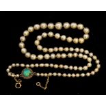 A natural pearl single row necklace, comprising graduated natural saltwater pearls ranging from