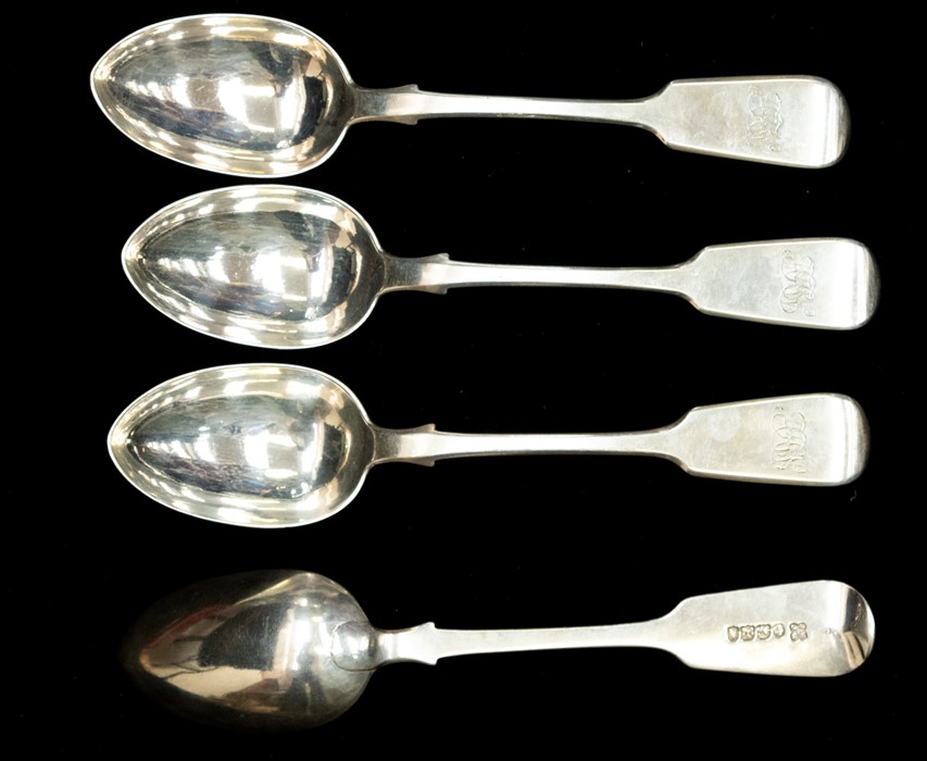 A set of six Victorian provincial silver fiddle pattern dessert spoons, each handle engraved with