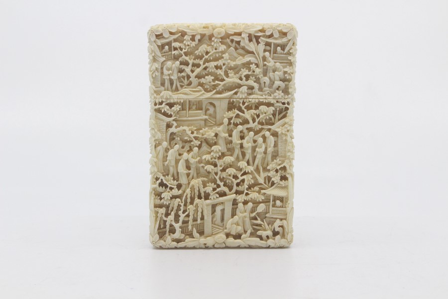 A Chinese Canton carved ivory card case, late 19th Century, of rectangular outline and worked in