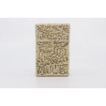 A Chinese Canton carved ivory card case, late 19th Century, of rectangular outline and worked in