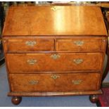 A Queen Anne period walnut bureau, circa 1710, the fall front enclosing a fitted interior, with