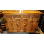 A Rupert Griffiths Arts and Crafts Monastic Woodcraft oak sideboard, fitted with two drawers over