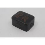 A Japanese bronze box, Meiji period, of rectangular outline with rounded corners, the hinged top