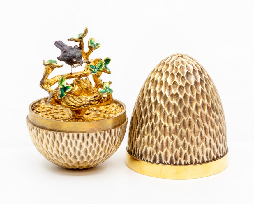 Stuart Devlin silver gilt surprise 'Robin' egg, decorative honeycomb like textured form opening to