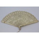 A Chinese Canton ivory brise fan, first half 19th Century, the guards carved with figures and