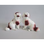 A Small Pair of Staffordshire Seated separate leg Spaniels. Red markings Date: circa 1860 Size: 12cm