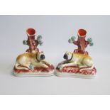 A Pair Staffordshire Spill Vases each with an English Mastiff recumbent on an oval base.  Date: