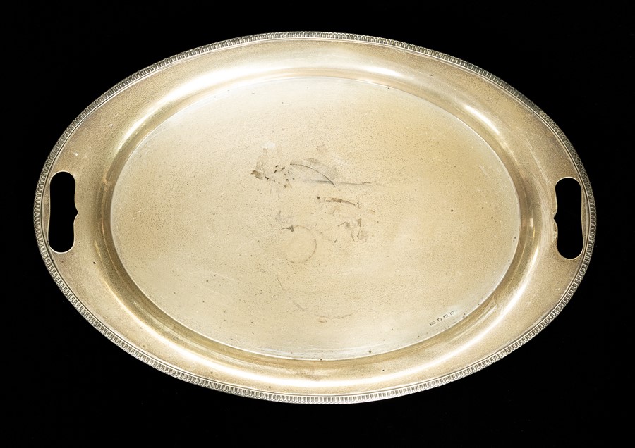 A George VI silver plain oval two intregal handled tray, egg-and-dart border, by Viner's of