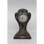 An Edwardian silver mounted mahogany cased mantle clock, Birmingham 1909,of waisted form, the silver