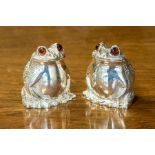 A pair of Modern silver novelty salt and pepper modelled as Frogs, each smiling squatting figure