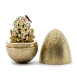 Stuart Devlin small silver gilt surprise 'rabbits ' egg, decorative finely textured form opening