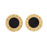 Bvlgari- A pair of 18ct gold and onyx circular disc earrings with the iconic logo inscribed to the