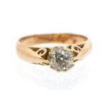An old cut diamond 15ct gold ring, comprising a central cushion cut diamond weighing approx. 0.70ct,
