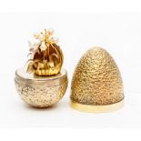 Stuart Devlin silver gilt surprise 'humming bird' egg, textured crater like decorative form