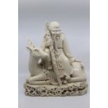 A large Blanc de Chine figure of Shoulao seated on a deer, Qing Dynasty, 19th Century, the