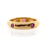 Cartier- A ruby and 18ct gold Cartier ring, comprising five round cut rubies flush set within a D