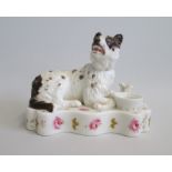 A Porcelain model of Wolf Hound  Pen and Ink Holder.  With brown markings. Laying  on a deep