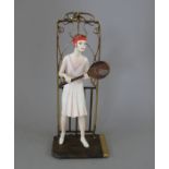 An Albany Fine China Co. model of a lady playing tennis incorporating a metal base from the '