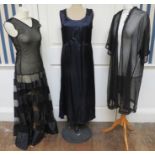 A Early 1930s heavy Tulle-fabric black evening dress, the bodice turns into four wide satin tiers of