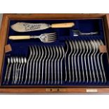 An Edwardian Mappin & Webb silver canteen of shell pattern flatware, Sheffield 1910, contained in