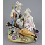 A nineteenth century Meissen figure of a seated hunstman talking with a maiden. He sits with his dog