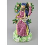 An early nineteenth century Staffordshire bocage figure, c.1820. It depicts Nicodemus and reads;