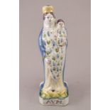 A late nineteenth, early twentieth century, probably continental, tin-glazed figure, c.1880-1920. It