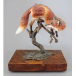 An Albany Fine China Co. model of a fox incorporating metal and a wooden base. Modelled by Neil