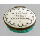 A Bilston oval enamel patch box, circa 1780, motto to cover A Present from Cranbrook, width 4cm