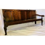 An early George III  oak five panel settle, Circa 1760, Moulded top with five moulded panel back,
