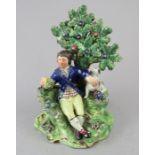 An early nineteenth century Staffordshire pearlware bocage figure, c.1810-20. It depicts a resting