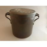 A late 19th Century Country house twin handled copper casserole pot and cover, height 24cm